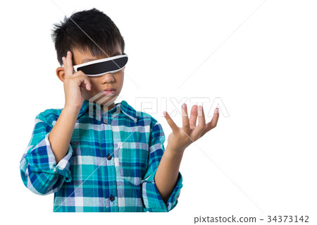 Boy using virtual reality glasses 34373142