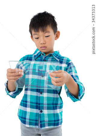 Boy using a glass digital tablet 34373313