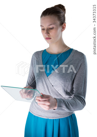 Teenage girl using a glass digital tablet 34373315