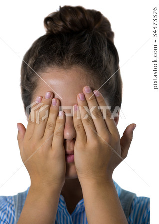 Teenage girl covering her eyes 34373326