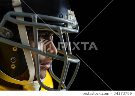 American football player with a head gear 34373799