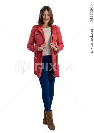 Full length of portrait of smiling young woman wearing warm clothing 34373869
