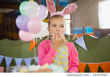 Birthday girl eating a cake 34374993