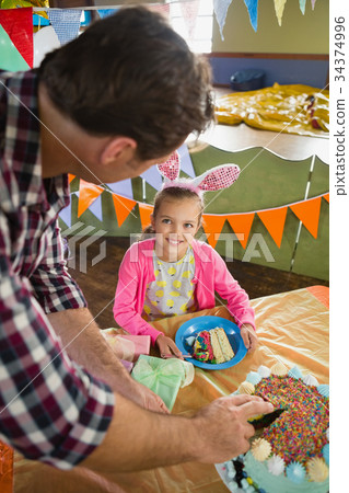 Father and daughter celebrating birthday at home 34374996