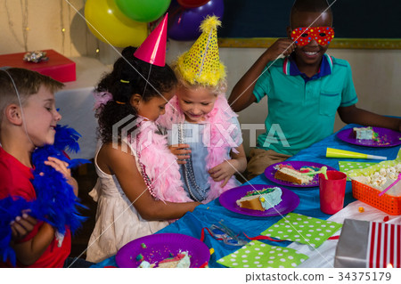 Children at table during party 34375179