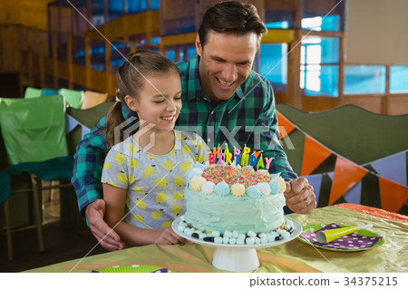 Father and daughter with birthday cake Father and daughter with birthday cake 34375215