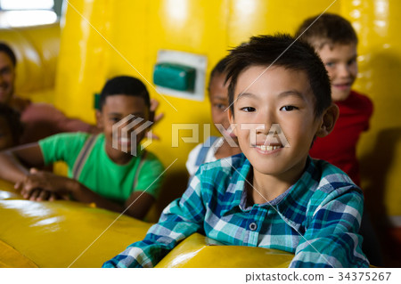 Children on bouncy castle 34375267