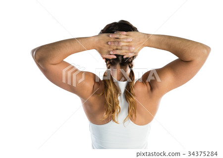 Rear view of rugby player with hands behind head 34375284