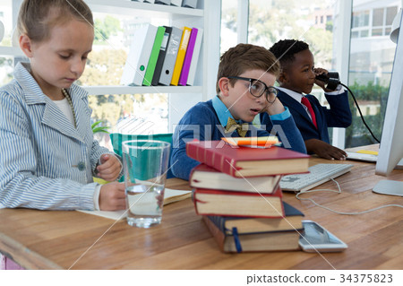 Kids as business executives working together 34375823