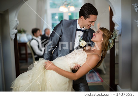 Wedding couple dancing in hall 34376553