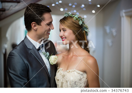 Wedding couple standing face to face 34376743