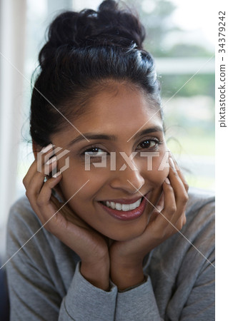 Close-up portrait of smiling woman 34379242