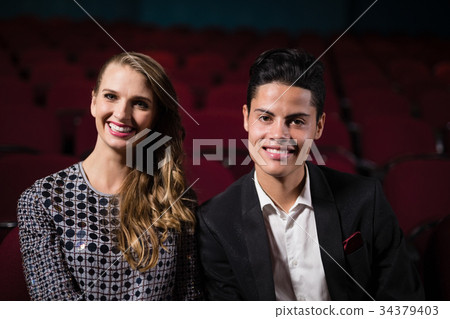 Couple watching movie in theatre 34379403