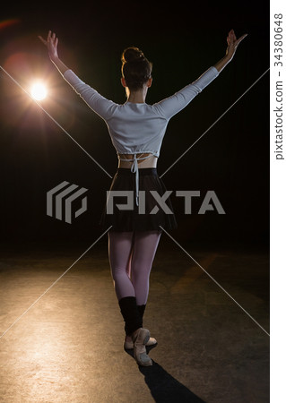 Ballerina practicing ballet dance on the stage Ballerina practicing ballet dance on the stage 34380648