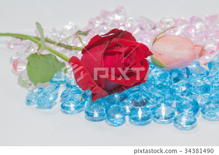 rose flowers are on the blue gemstones. rose flowers are on the blue gemstones. 34381490