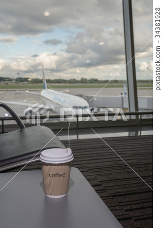 Cup of coffee in airport's business lounge Cup of coffee in airport's business lounge 34381928
