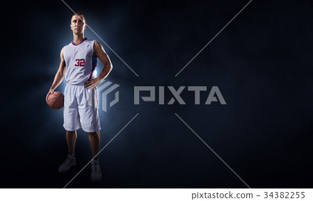 Basketball players on a black background 34382255