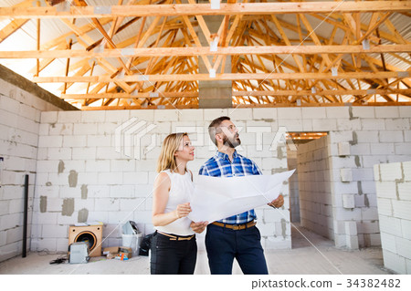 Architects and civil engineer at the construction 34382482