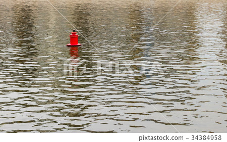 Bright red metal buoy float mark for ships Bright red metal buoy float mark for ships 34384958
