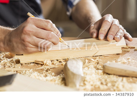 Carpenter at work 34387910