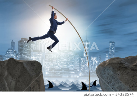 Businessman in pole vaulting concept Businessman in pole vaulting concept 34388574