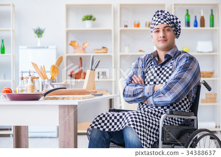 Disabled young husband frying at kitchen 34388637