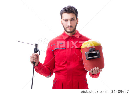 Young repairman with a welding gun electrode and a 34389627