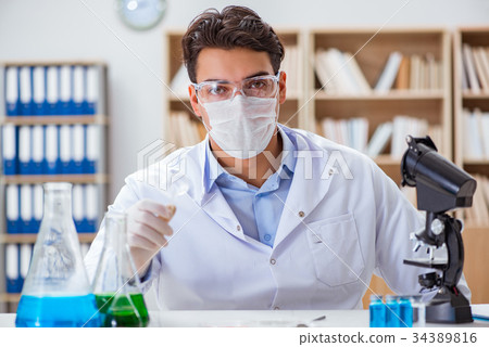Male doctor working in the lab on virus vaccine 34389816
