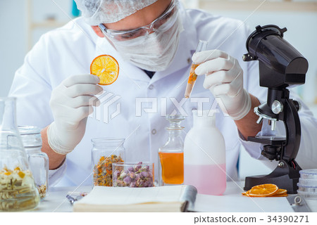 Chemist mixing perfumes in the lab Chemist mixing perfumes in the lab 34390271