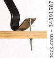 A pry bar removing a nail 34391587
