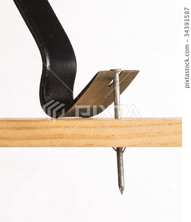 A pry bar removing a nail 34391587