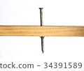 Galvanied Nail Through Wood 34391589