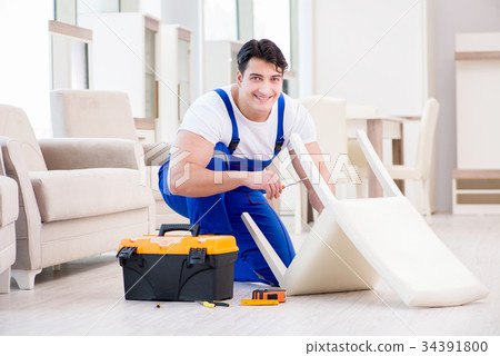 Furniture repairman working in store Furniture repairman working in store 34391800