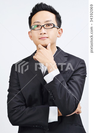 Confident Asian businessman thinking 34392069