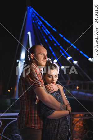 Sensitive couple relationships. Urban background Sensitive couple relationships. Urban background 34393110