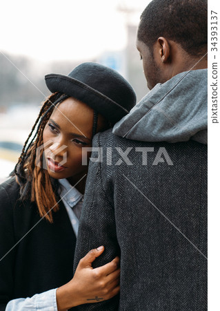 Melancholic mood. African American couple 34393137