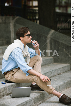 Young man with bad habits. Modern youth Young man with bad habits. Modern youth 34393246