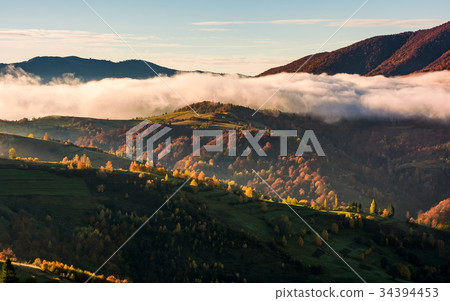 cloud rising above the rolling hills in autumn 34394453