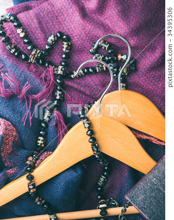 Wooden clothes hangers. Winter woman accessories Wooden clothes hangers. Winter woman accessories 34395306