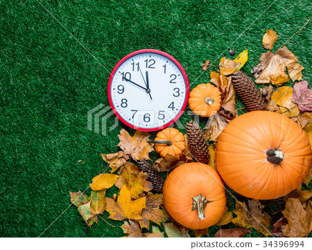various autumn leaves and orange pumpkins various autumn leaves and orange pumpkins 34396994