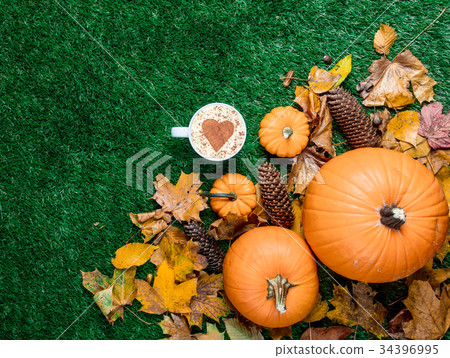 Cup of cappuccino with heart shape and leaves Cup of cappuccino with heart shape and leaves 34396995