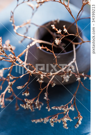Vintage vase with dry branch with flowers close up Vintage vase with dry branch with flowers close up 34399213