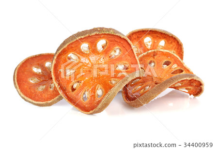 Aegle marmelos. Dry bael fruit on white background Aegle marmelos. Dry bael fruit on white background 34400959