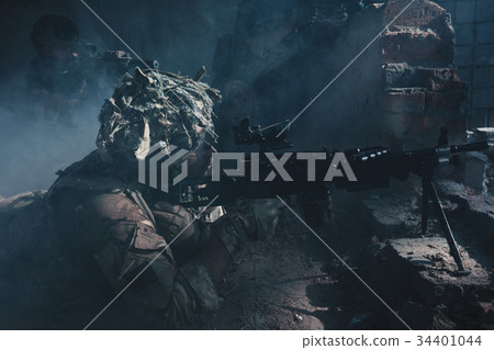 Special Forces soldiers in action. A soldier is preparing to make a shot 34401044