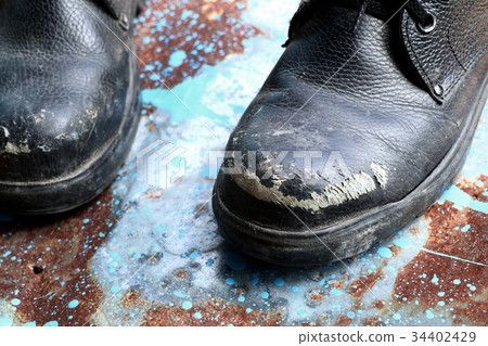 Old leather shoes Old leather shoes 34402429