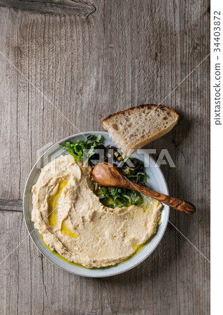 Hummus with olives and herbs 34403872