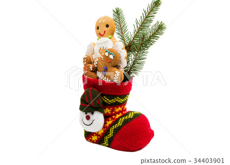Biscuits in a christmas sock isolated 34403901