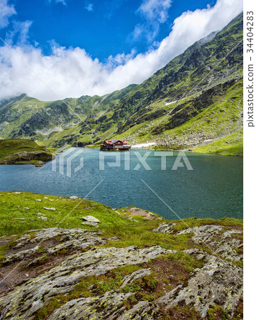 Mountain lake. The lake between the rocks. Hotel Mountain lake. The lake between the rocks. Hotel 34404283