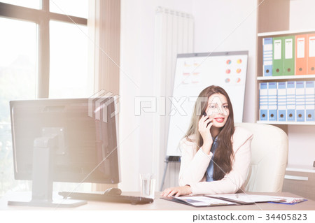 Young professional businesswoman working in the Young professional businesswoman working in the 34405823