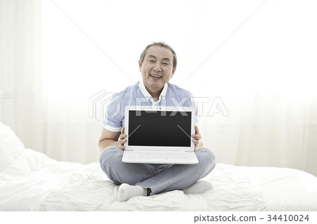 Middle-aged, laptop Middle-aged, laptop 34410024